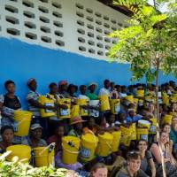 Study abroad students distributing water filters in Haiti